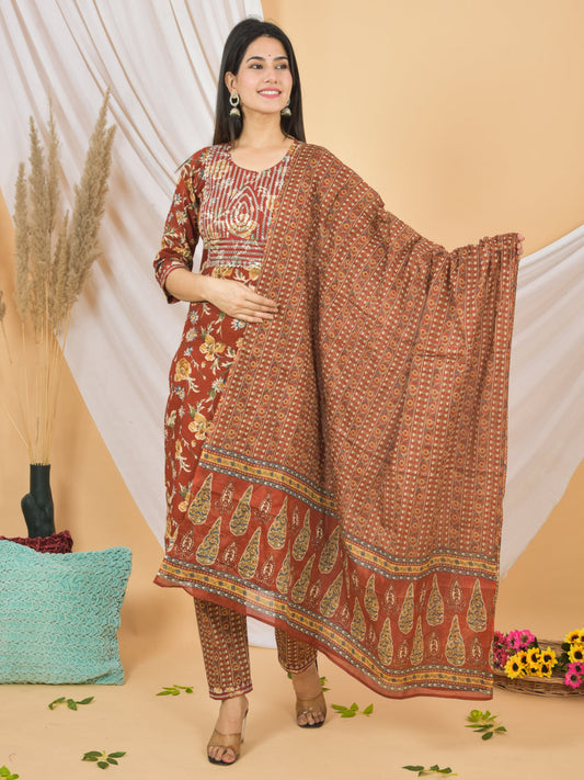 Woman wearing a patterned dress with a matching dupatta on a beige background > Mitrika