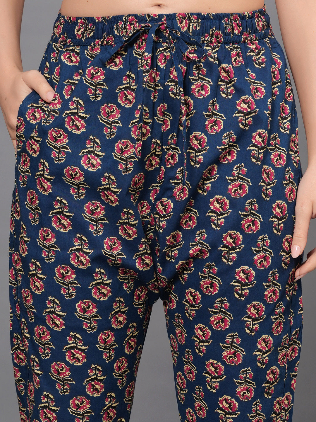 Floral patterned pants on a plain background