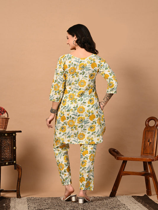 Woman wearing a floral kurta with yellow flowers on a beige background