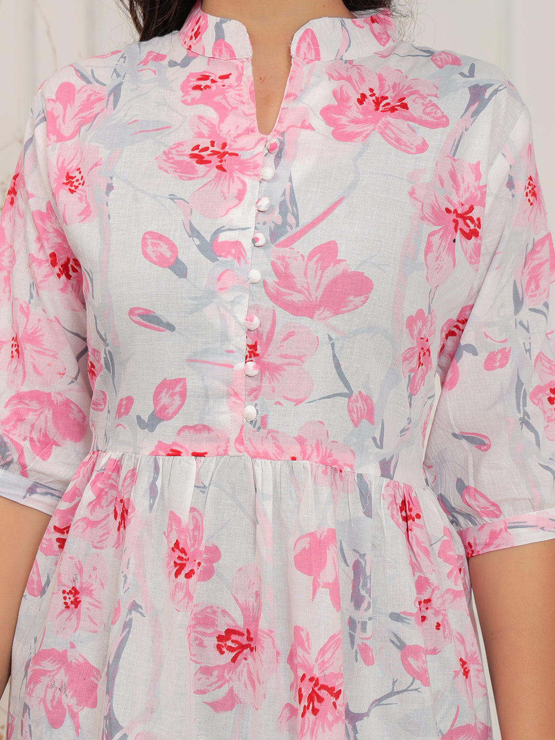 Floral dress with pink flowers on a light background