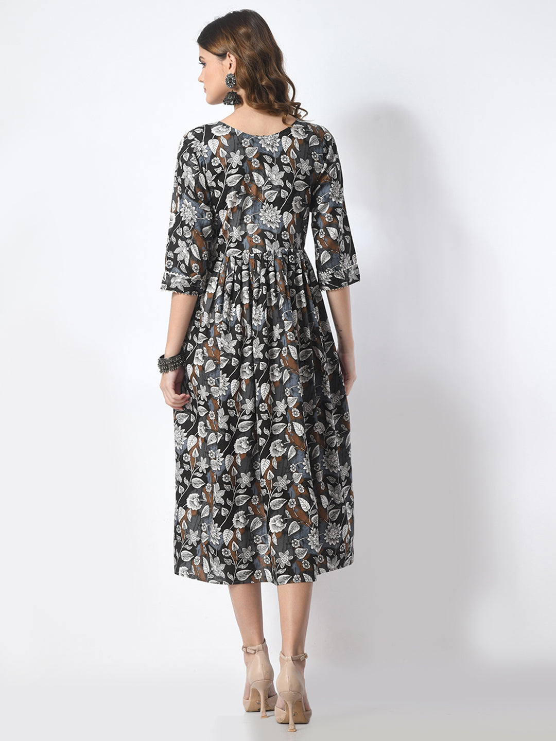 Woman wearing a floral dress on a white background