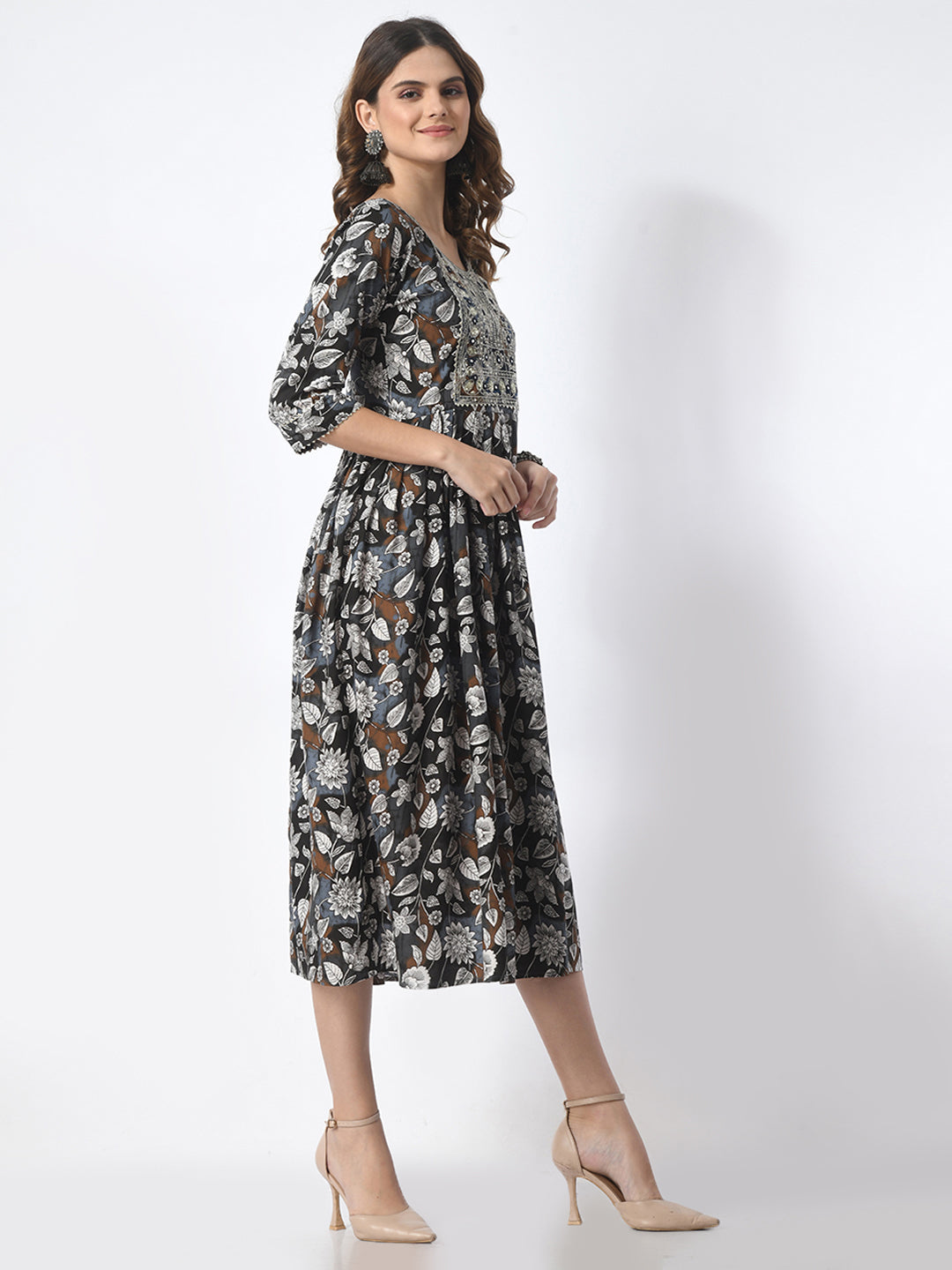Woman wearing a floral dress on a white background