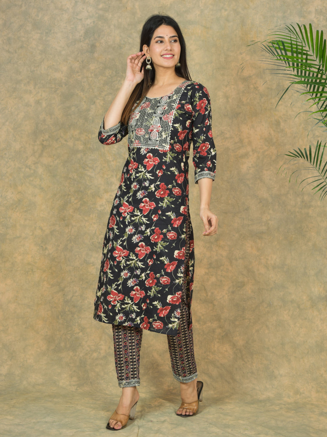 Woman wearing a floral dress with a textured beige background