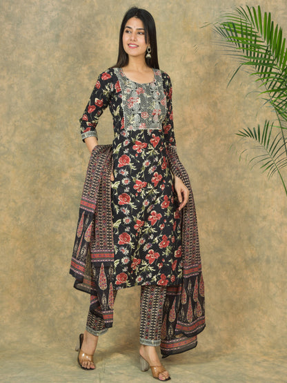 Woman wearing a floral traditional outfit with a plain background