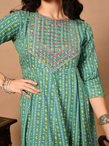Green patterned dress with a brown background