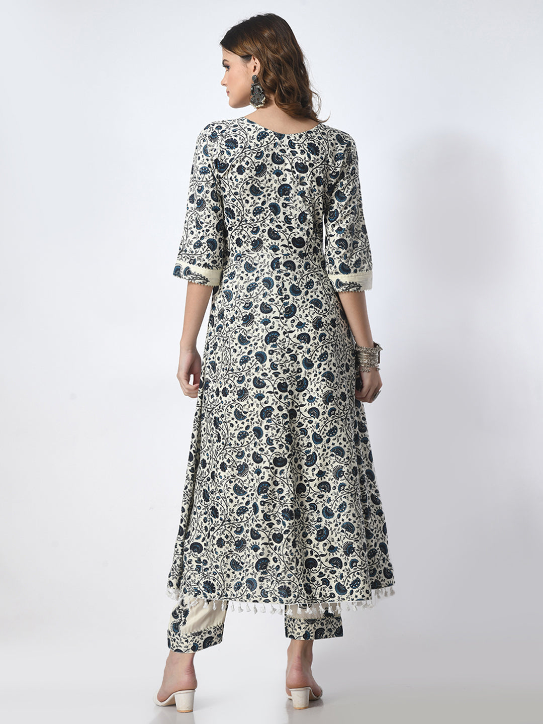 Woman wearing a floral dress on a white background