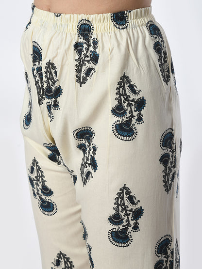White pants with black floral embroidery on a white background