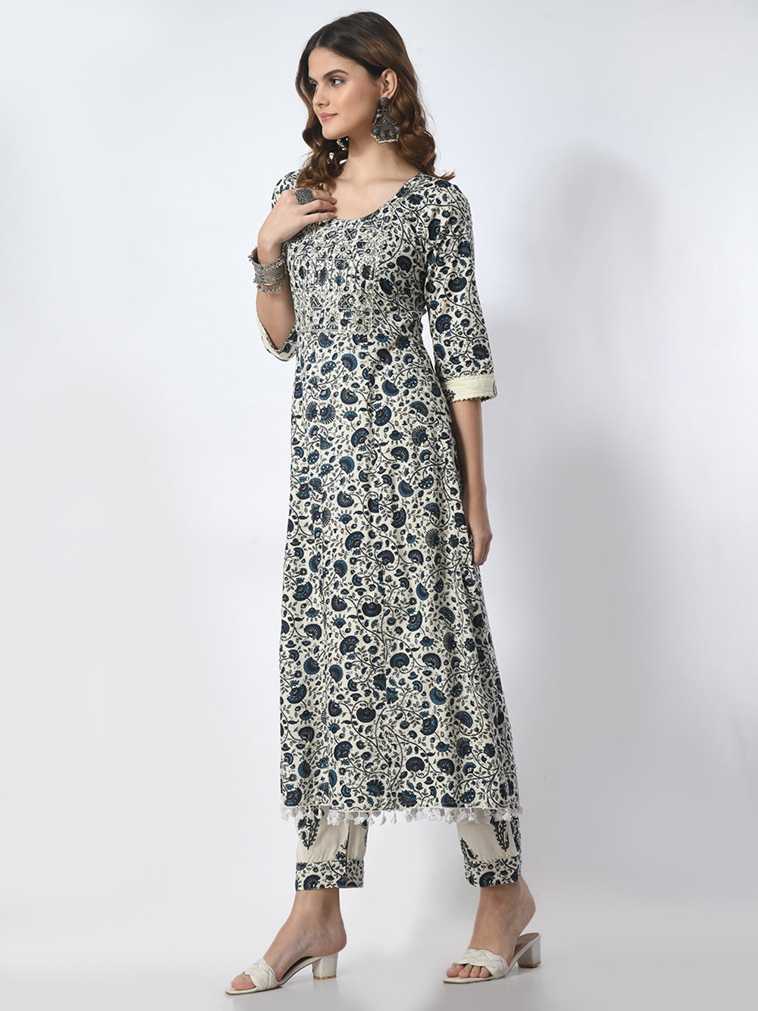 Woman wearing a floral kurta with white background