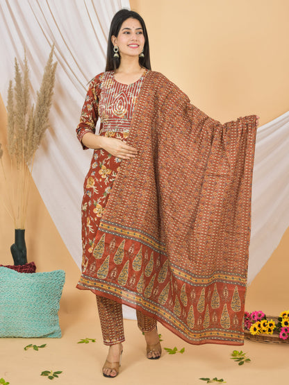 Woman wearing a patterned dress with a matching dupatta on a beige background > Mitrika