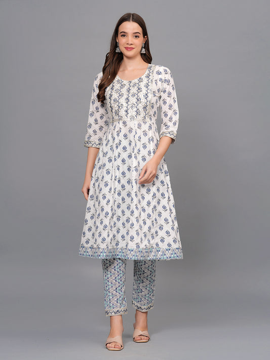 Woman wearing a floral dress and pants set on a gray background >Mitrika