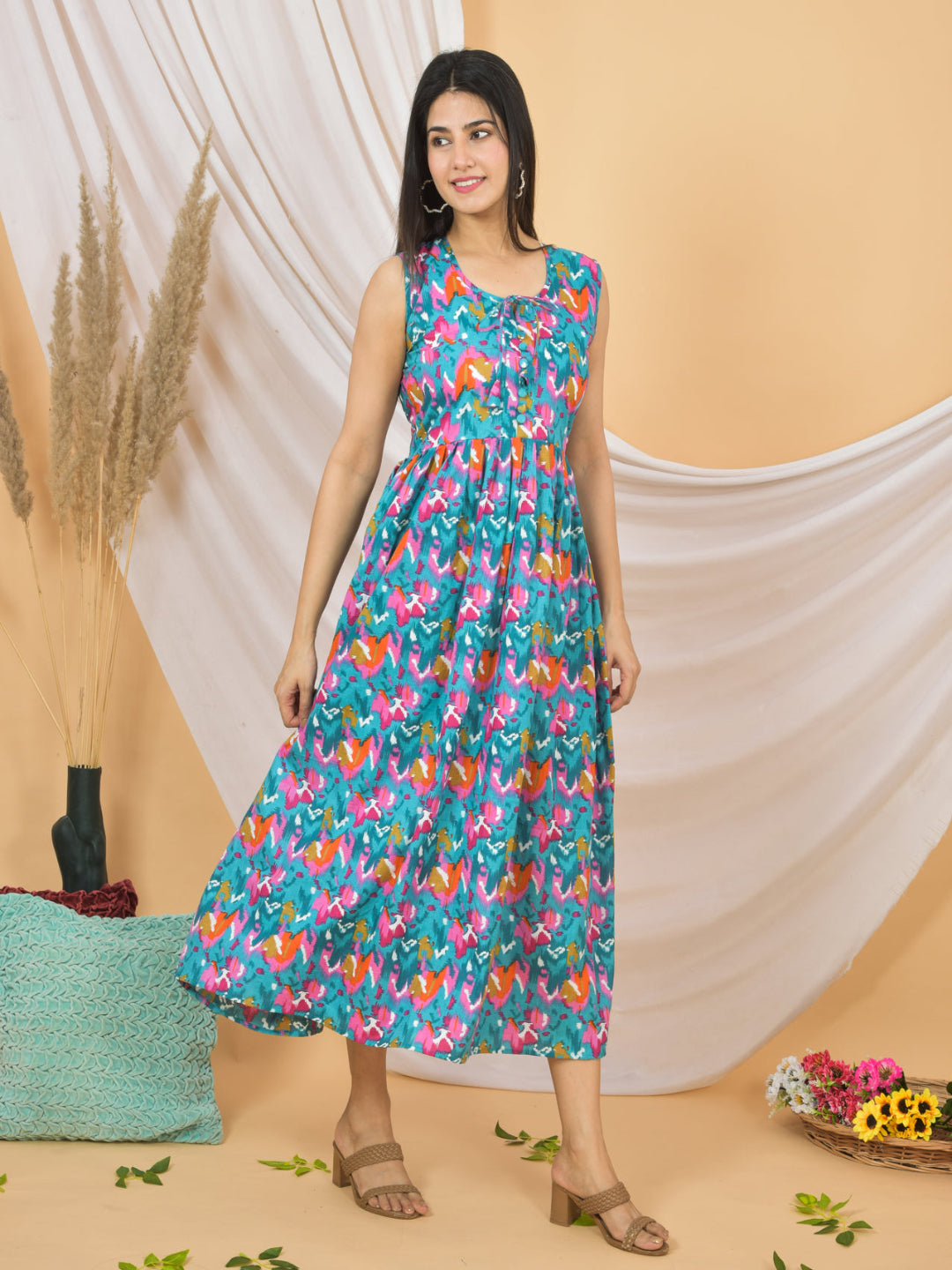 Woman wearing a colorful floral dress against a beige background