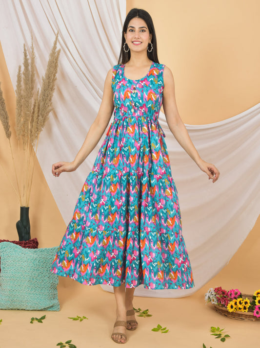 Woman wearing a colorful floral dress against a beige background > Mitrika