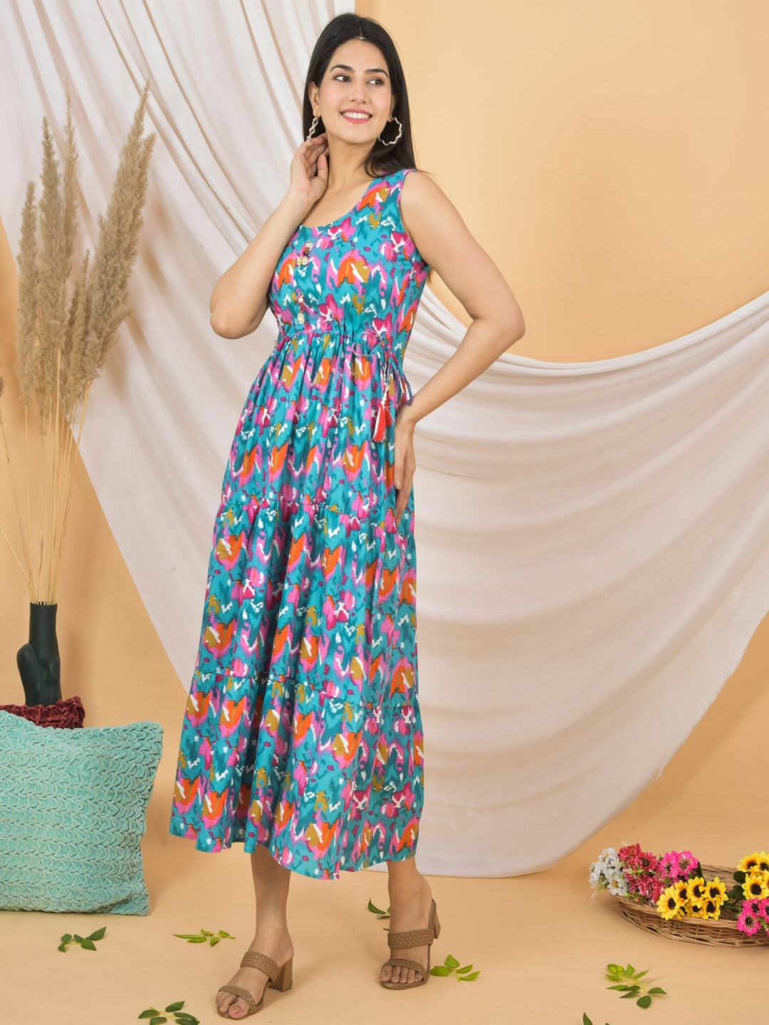Woman wearing a colorful floral dress against a beige background