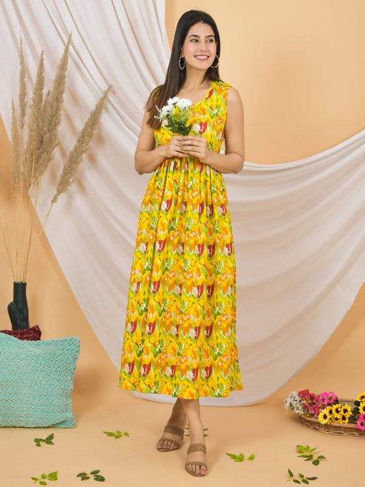 Woman wearing a yellow floral dress holding flowers against a beige background > Mitrika