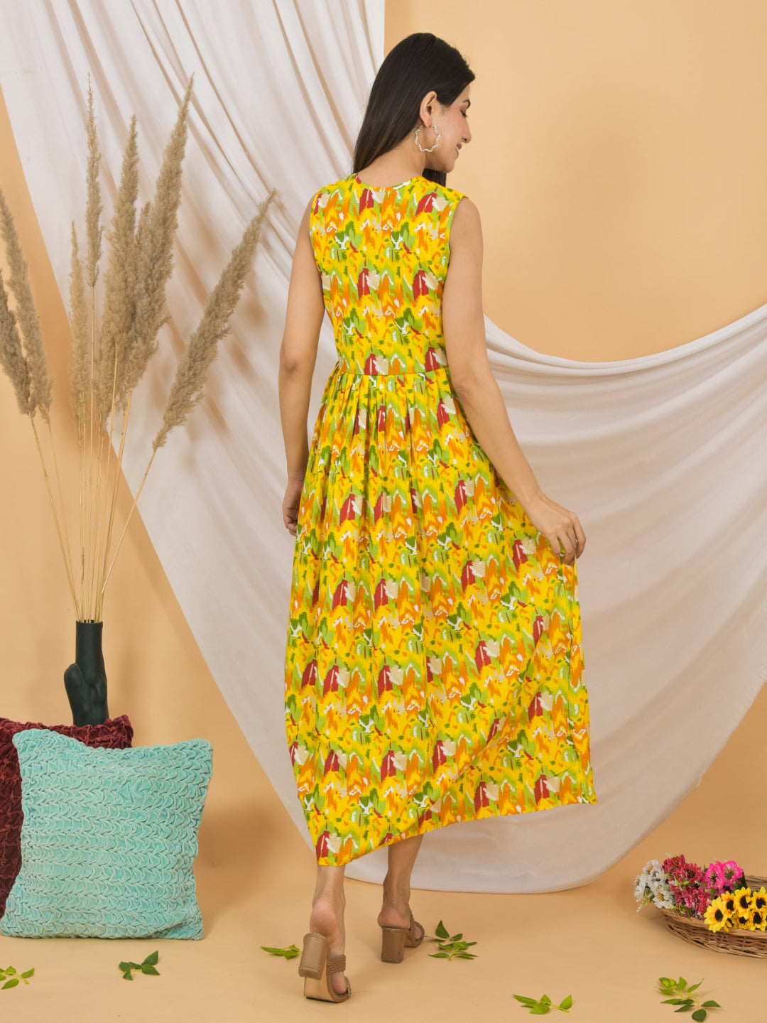 Woman wearing a yellow floral dress against a beige background with decorative elements.