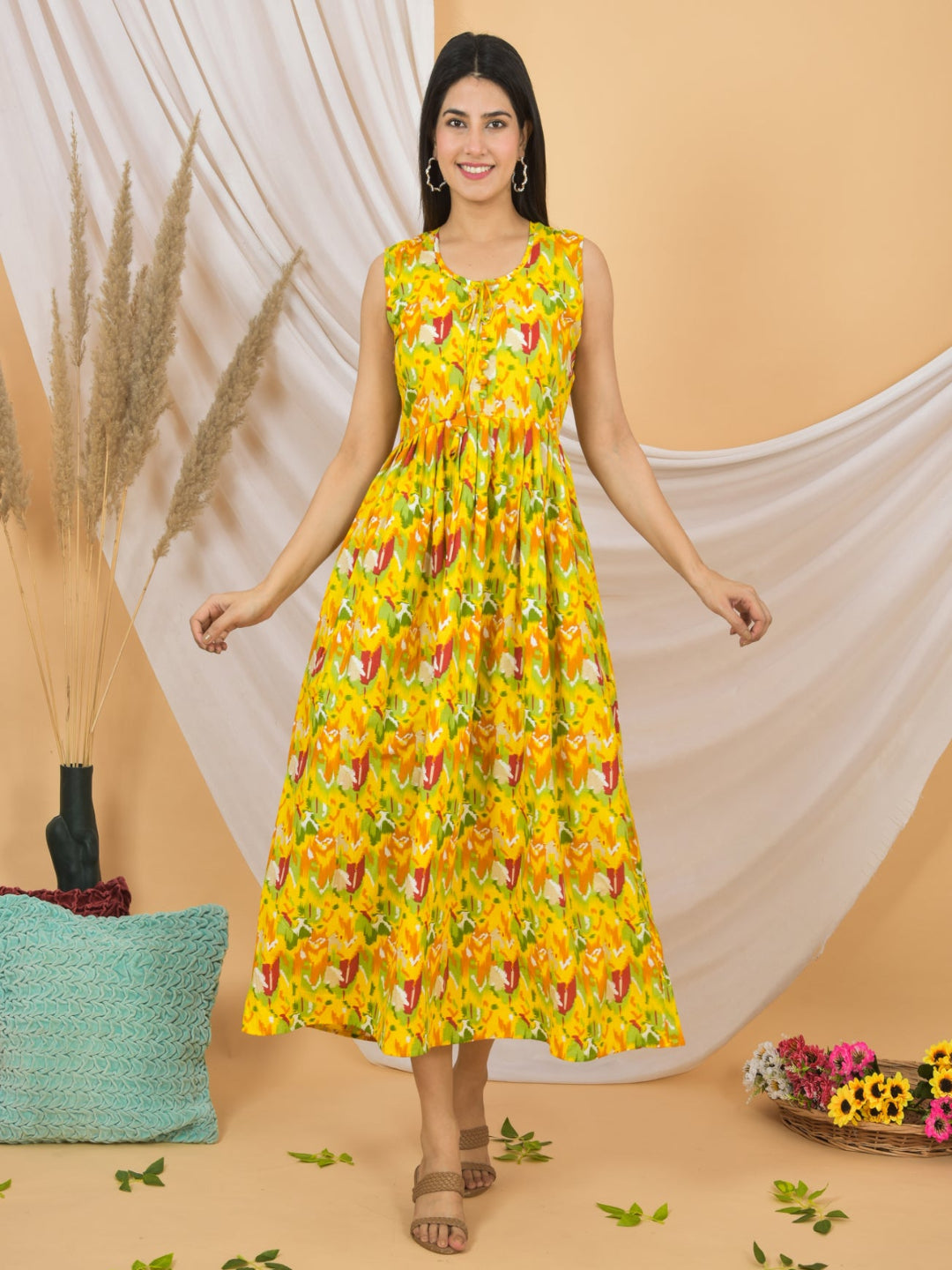 Woman wearing a yellow floral dress against a beige background
