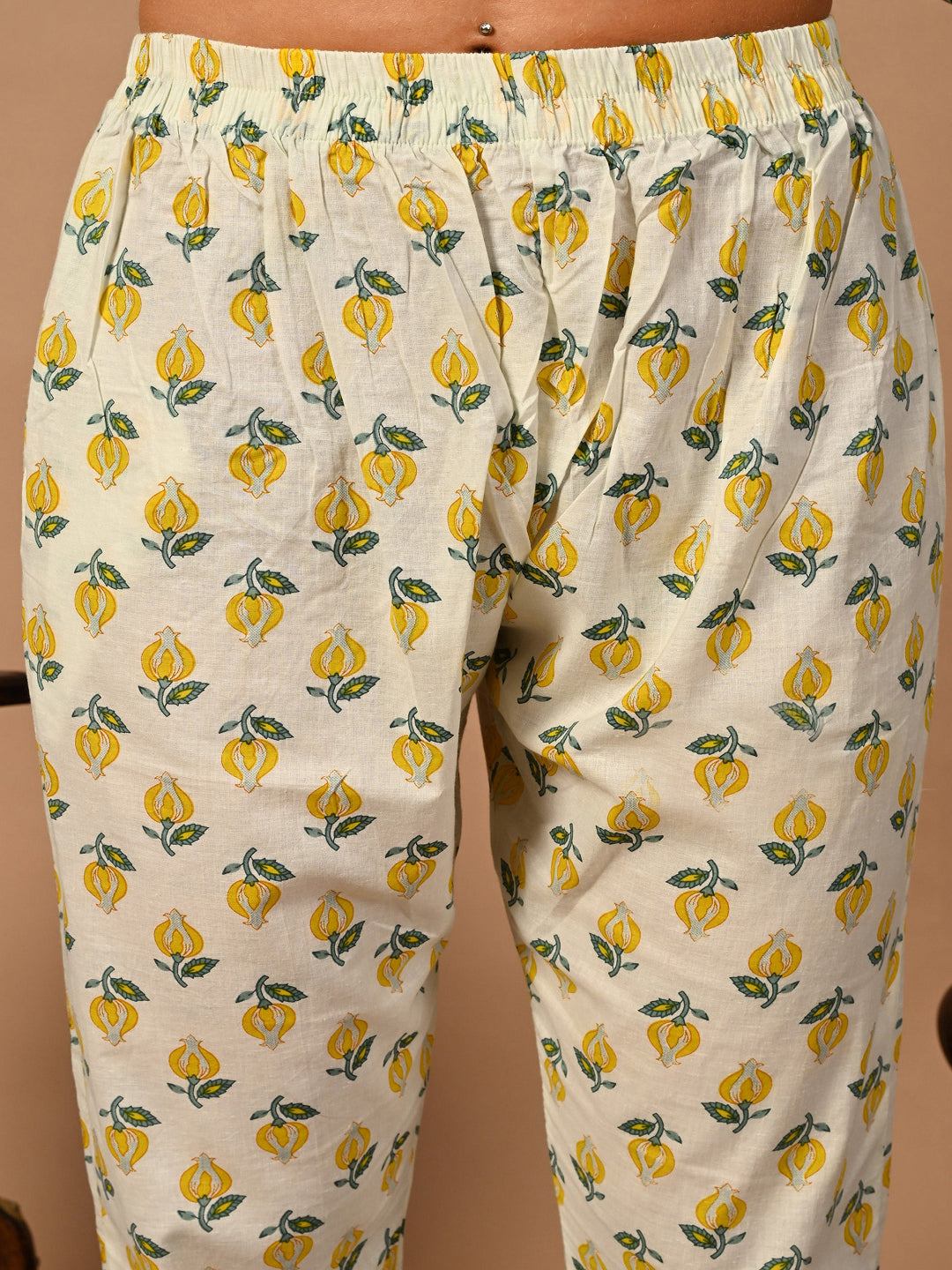 Pajama pants with yellow floral pattern on a beige background