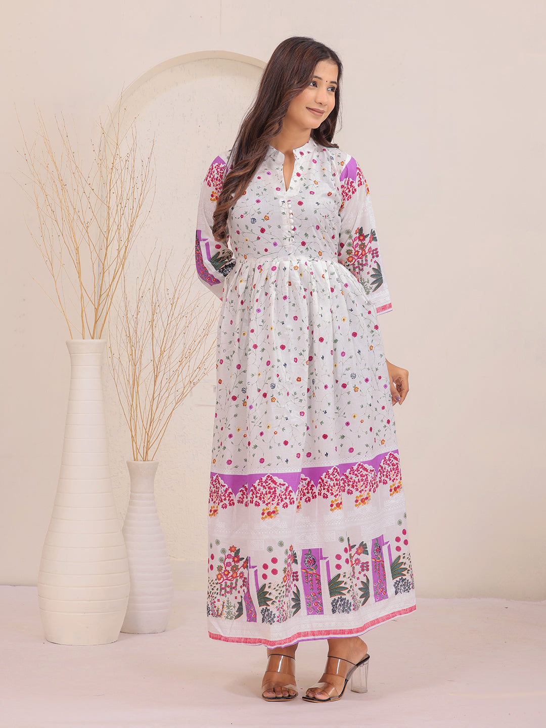 Elegant white printed dress with 3/4 sleeves and flared hem