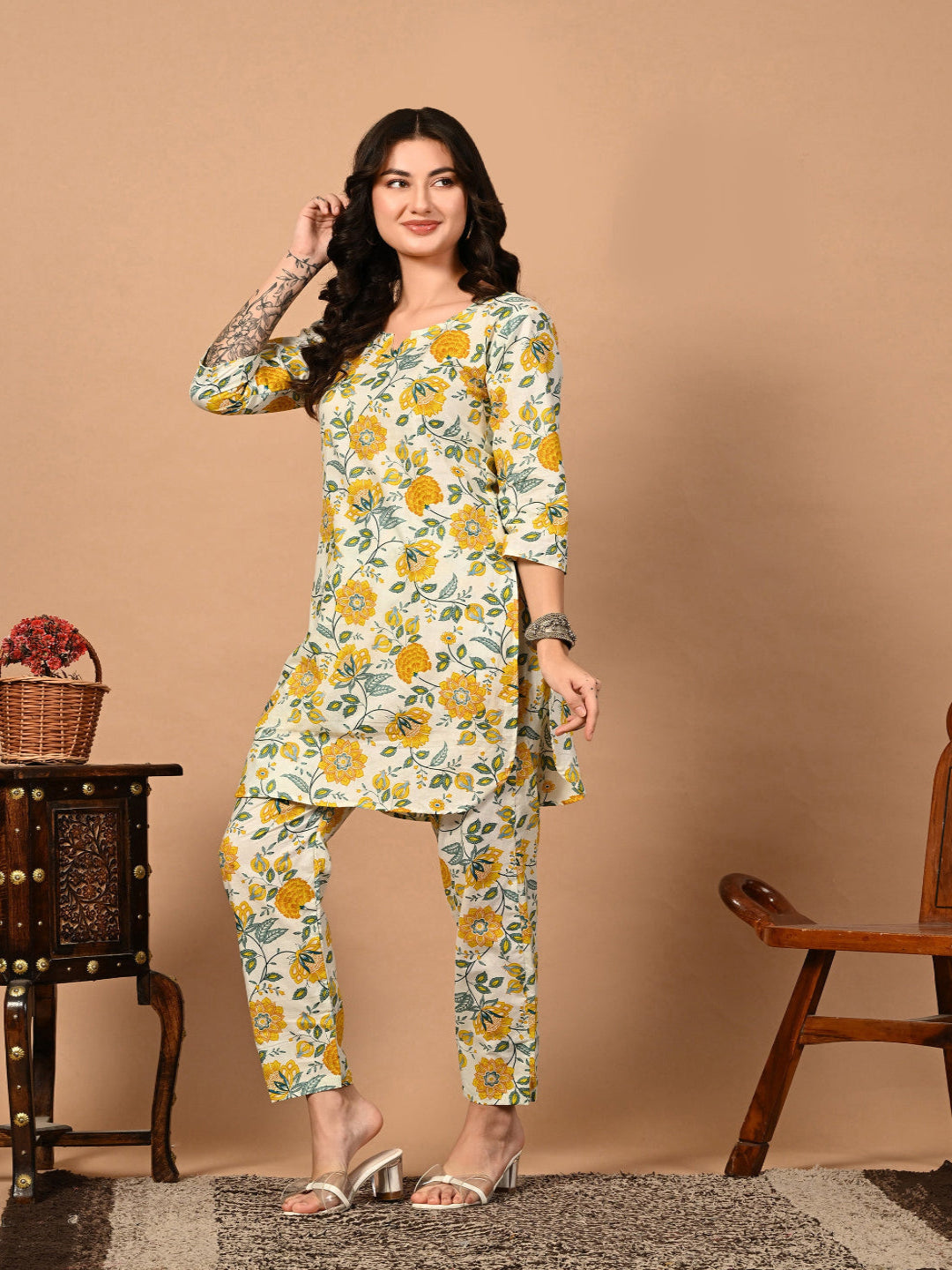 Woman wearing a floral outfit against a beige background
