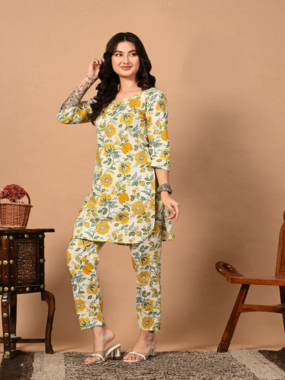 Woman wearing a floral outfit against a beige background